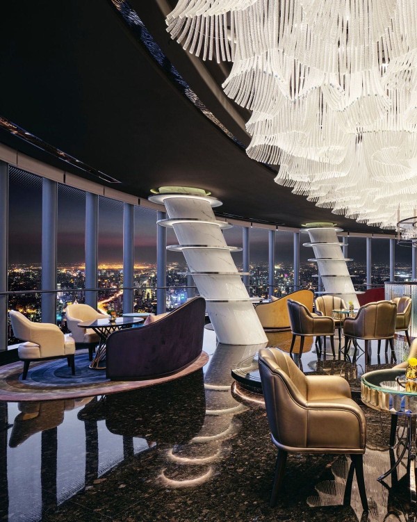 View of an hotel's restaurant inside with an expensive piano and bar counter